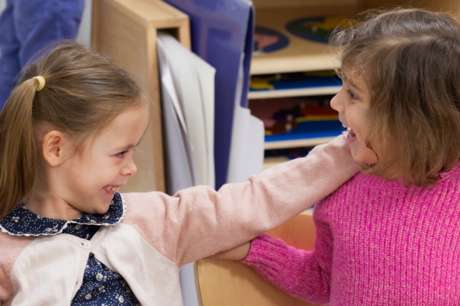 two students smiling together