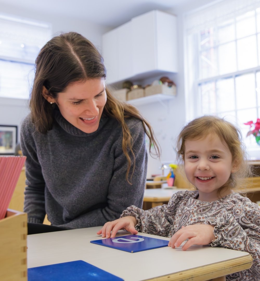 teacher and student practicing letters