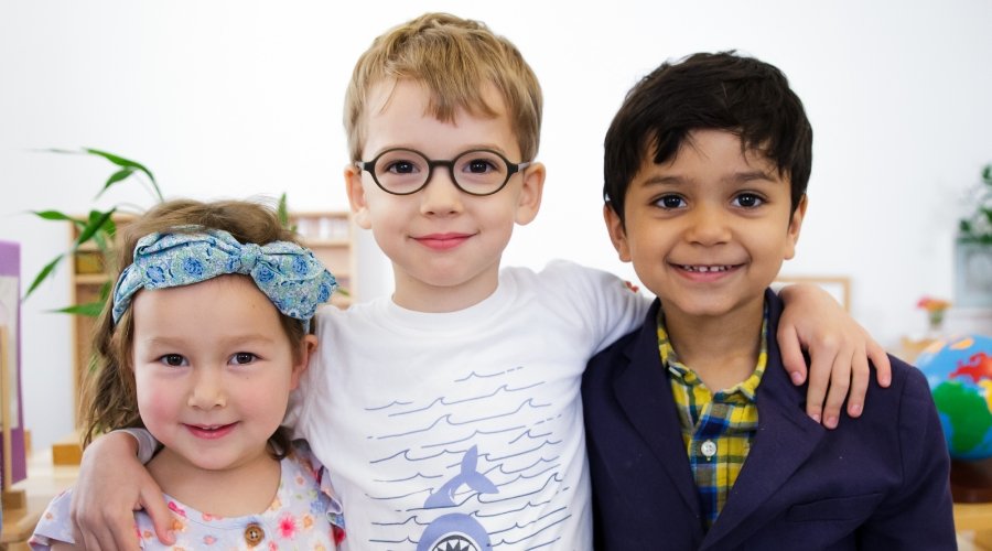 three students standing together