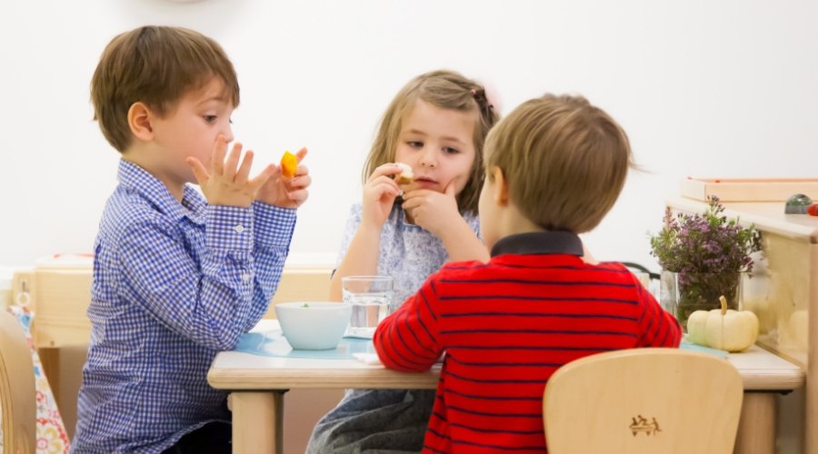 three students eating lunch