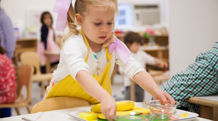 student organizing a tray of items